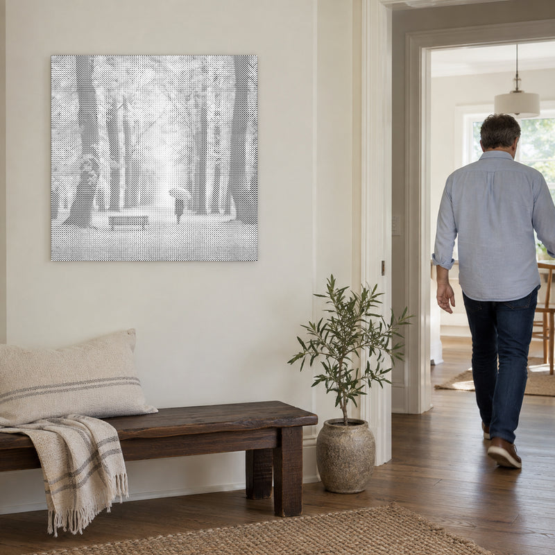 Dot-painting canvas “Autumn Forest”, on a light wall with a person walking through the doorway nearby.