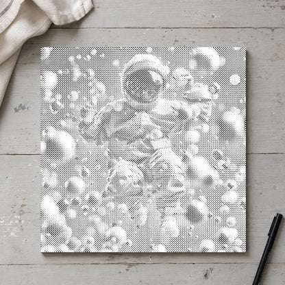Dot-painting canvas “Abstract Astronaut”, seen from above on a worktable in soft daylight.