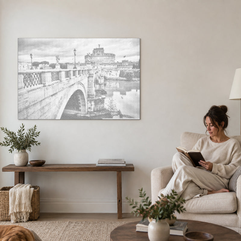 Dot-painting canvas “Castel Sant Angelo Rome”, on a living-room wall with a person reading in an armchair nearby.