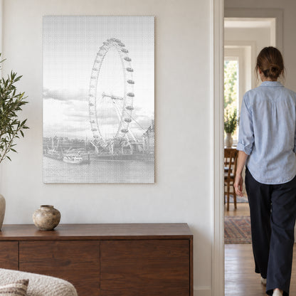 Dot-painting canvas “London Eye”, on a light wall with a person walking through the doorway nearby.