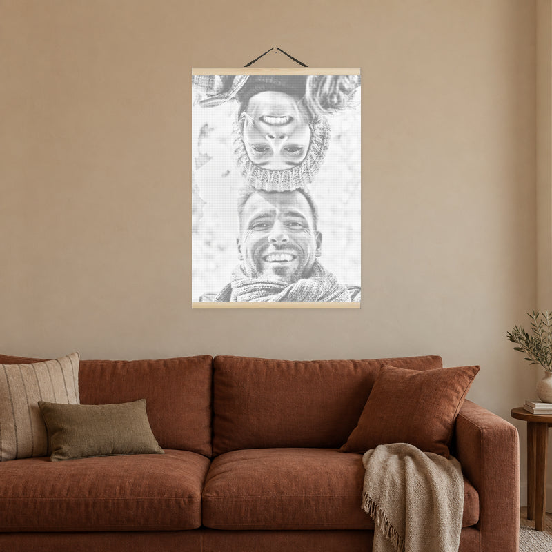 Magnetic Frame for Dot Painting, on a warm clay-coloured wall above a rust-coloured sofa.